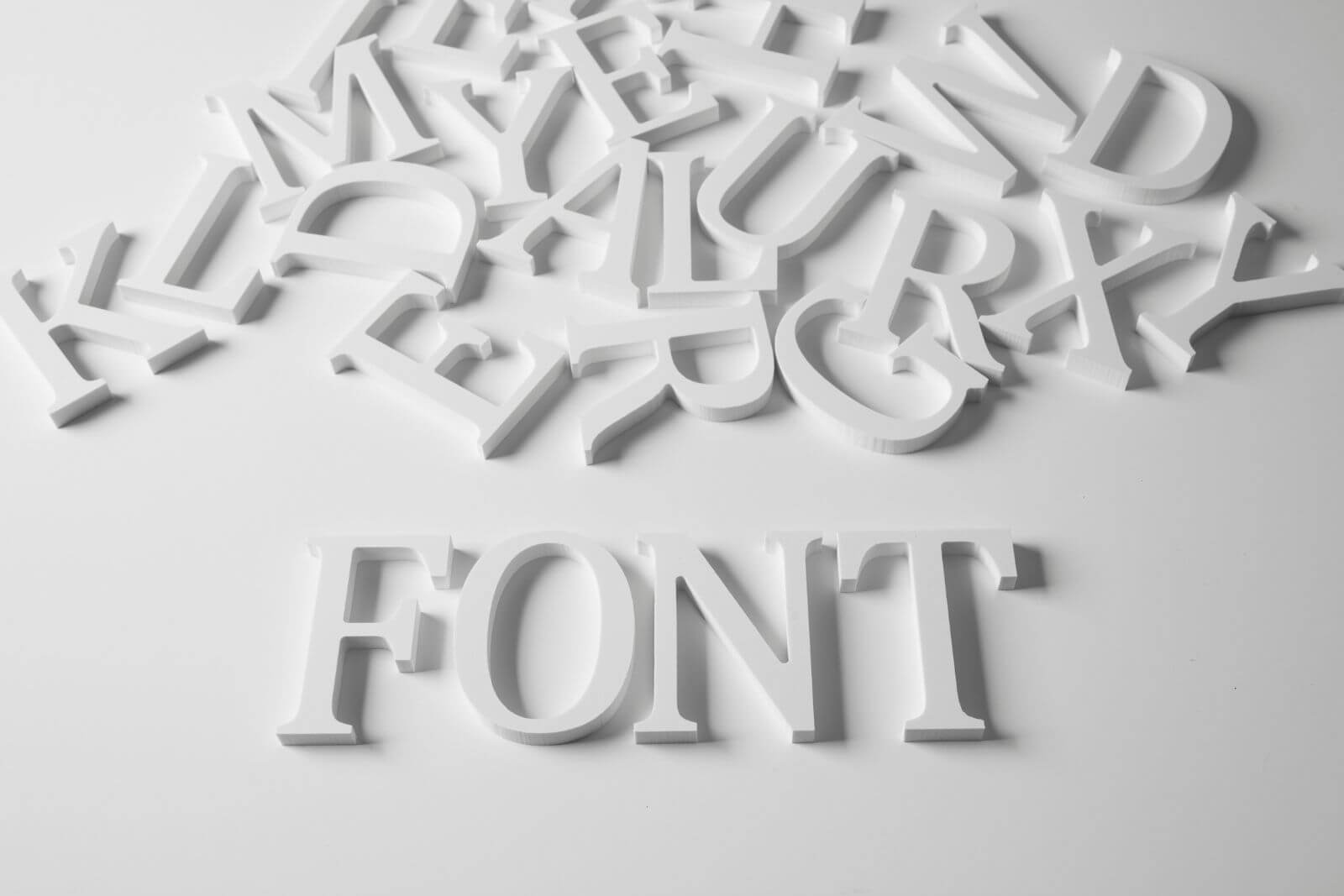 White 3D serif typography spelling font for graphic design & branding in Torrance, CA